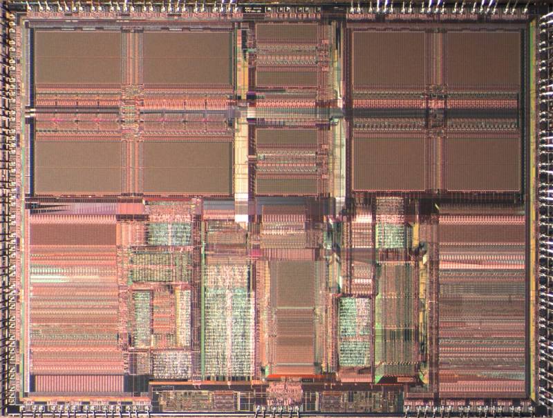 High-resolution macro silicon die shot showing CPU execution units, cache hierarchy, and integrated controller silicon blocks.