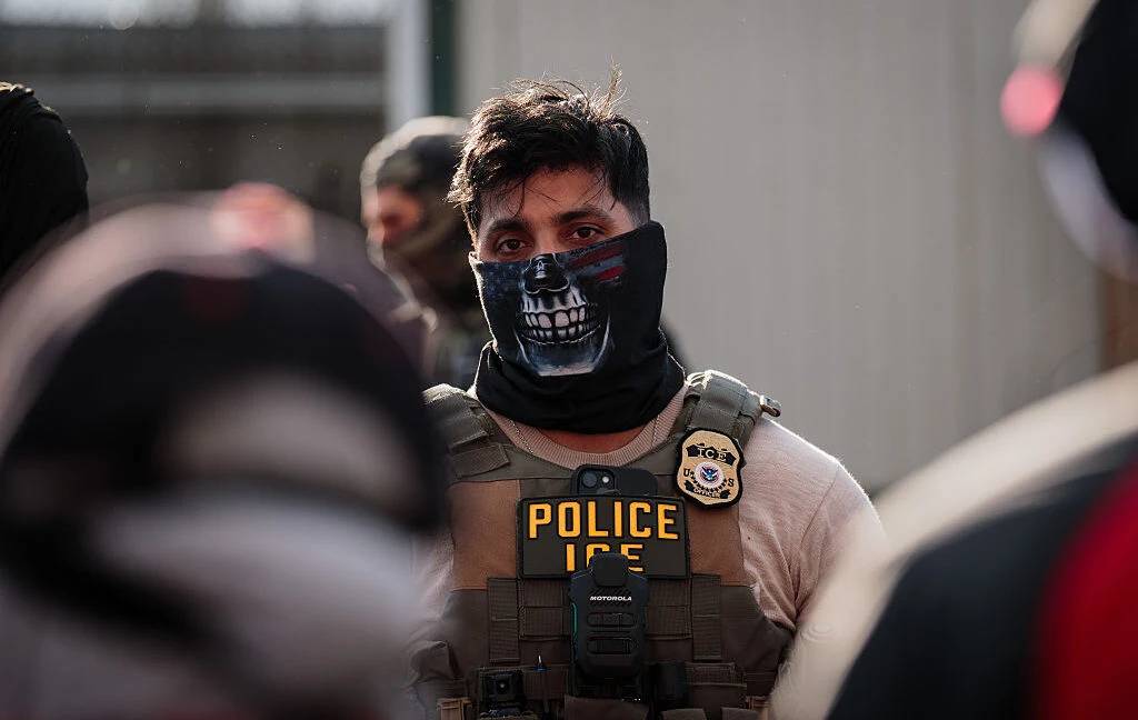 Federal law enforcement officers in tactical uniform on official field deployment.