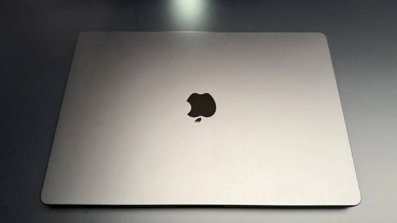 Exterior view of 16-inch MacBook Pro closed unibody chassis on a testing bench.